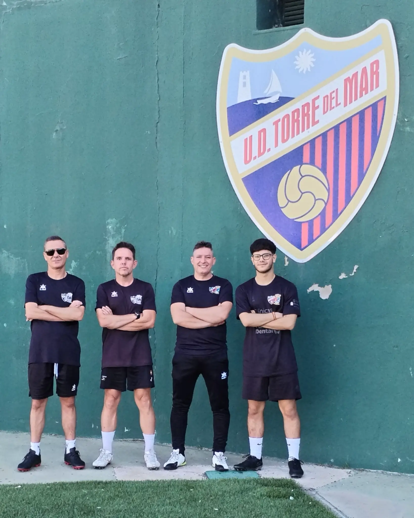 David Roa Ruiz with fellow coaches at club facilities