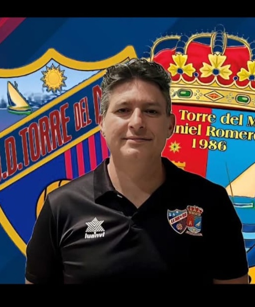 Portrait of David Roa Ruiz in coaching apparel